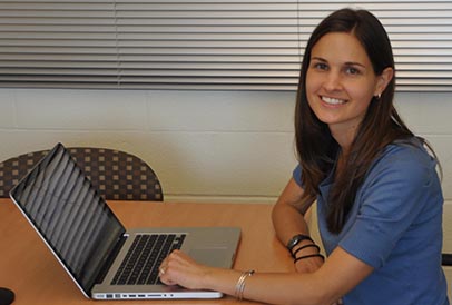 A New Literacies researcher at a laptop